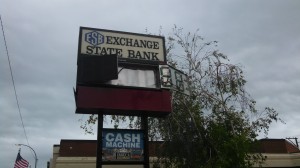 Exchange State Bank sign riddled by hail 