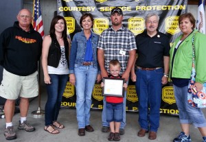 Seth Thompson and family (father Marv, wife Michelle, son Taytum, mother Melinda) with Governor Terry Branstad and Lt. Gov. Kim Reynolds