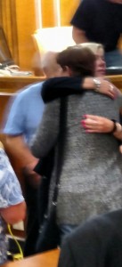 Brenda Nelson gets a hug after the 3-0 decision to reappoint, from Kenner Baxter, who serves on the Cass County Board of Review. 